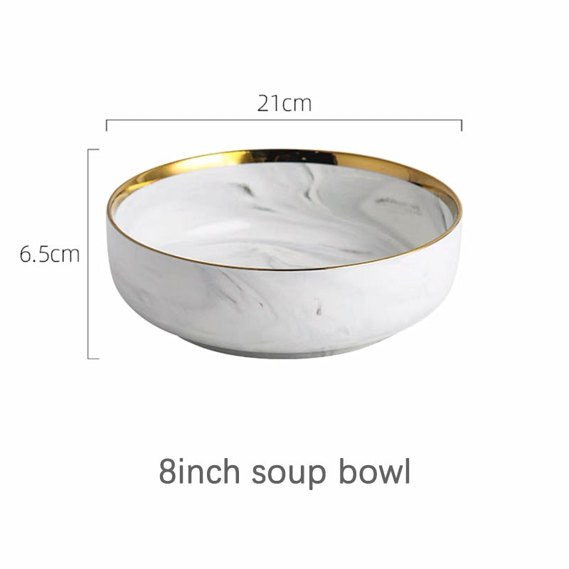 Białe talerze ceramiczne z dekoracyjnym złotym paskiem